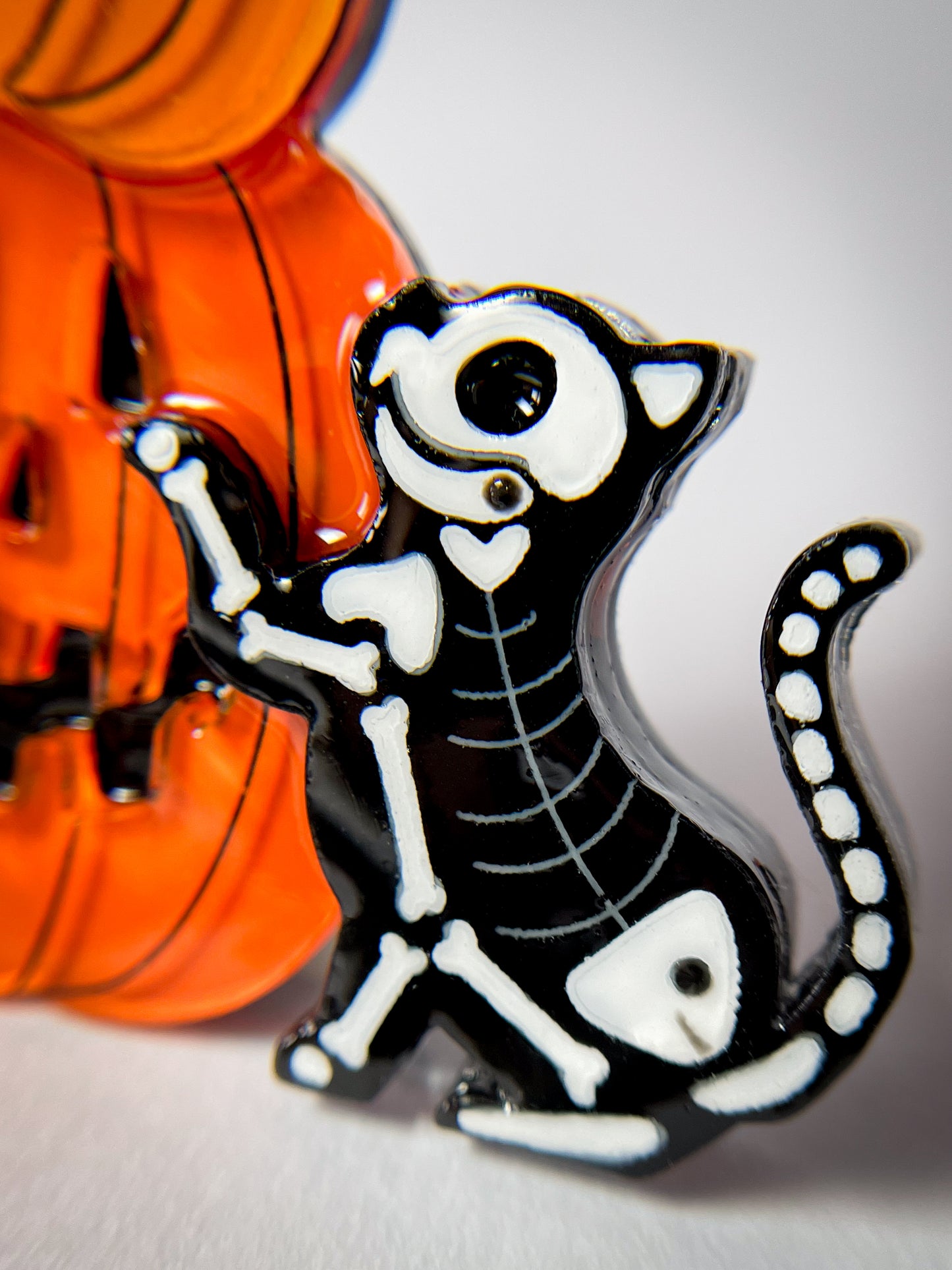 Jack-o'-Lanterns with a skeleton kitty brooch