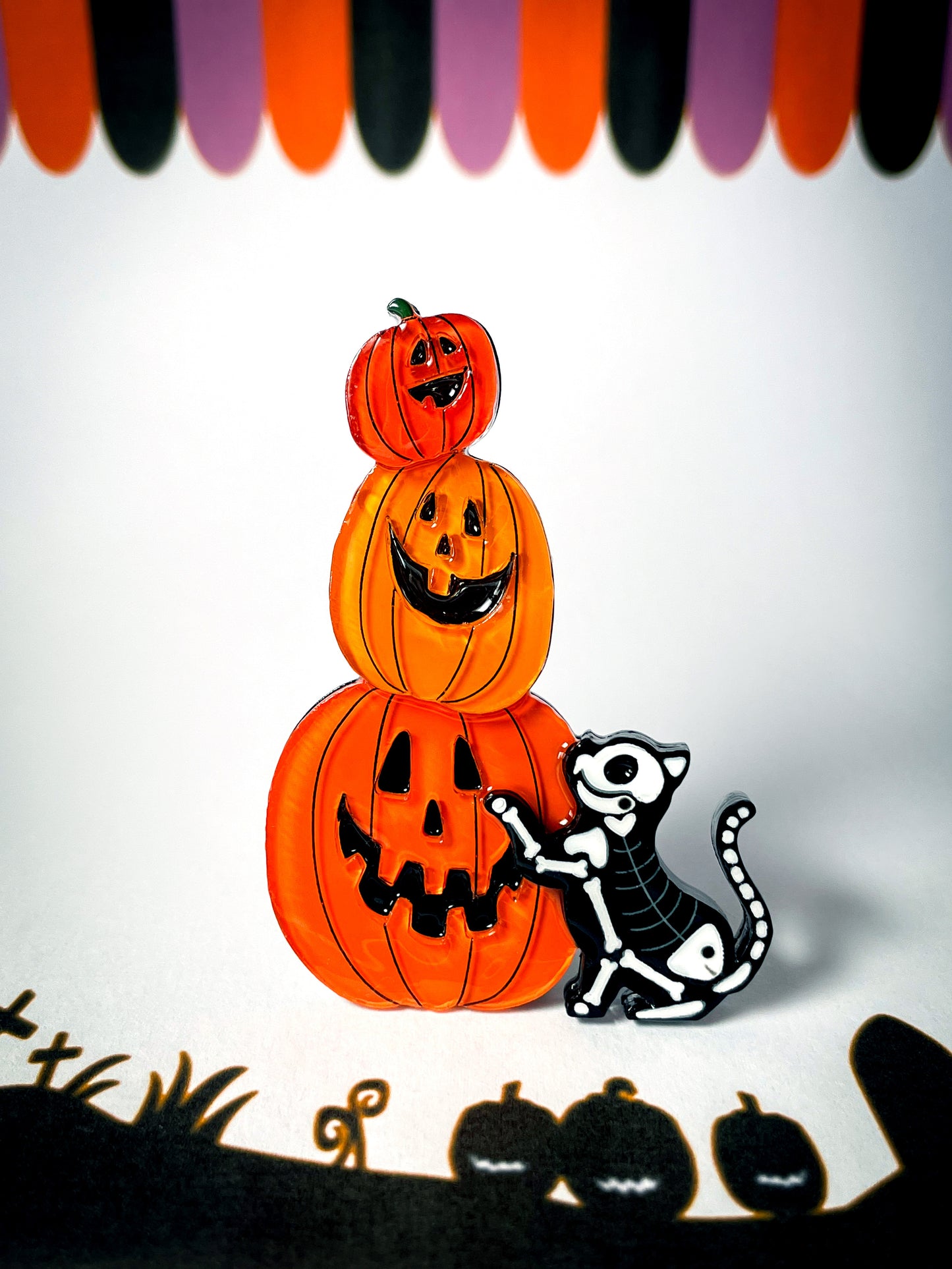 Jack-o'-Lanterns with a skeleton kitty brooch